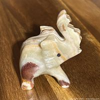 Front view of carved stone elephant figurine