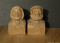 Front view of both carved candlestick holders