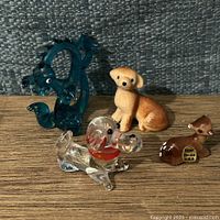 All four miniature figurines on tabletop