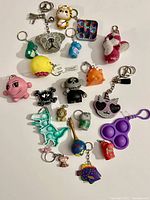 Overview of entire assortment of novelty keychains spread out