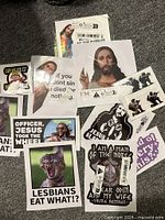 Spread of assorted stickers laid out on carpet