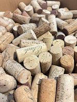 Close-up of assorted wine corks showing imprints and staining