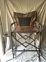 Front view of Cabela's extra-tall director's chair showing seat height, mesh back, frame and tags