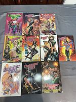 Nine Danger Girl graphic novels arranged in three rows
