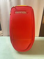Front view of red Ferrari roller bag upright