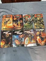 Front covers of all eight Ghost Rider trade paperbacks