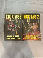 Front covers of both hardcovers showing titles Kick-Ass and Kick-Ass 2