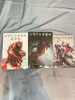 Front covers of the three Carnage graphic novels
