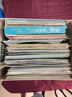 Top view of box filled with LP records showing Background Moods set and quantity