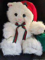 Close front view of plush cat out of box