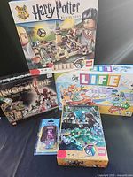 Group shot of all board games and figure pack