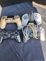 Group shot of all four controllers showing variety and cords