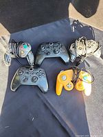 Front view of all six controllers showing designs and colours