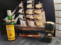 Lot overview: model ship, whisky bottle, ceramic jug