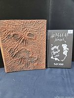 Front view of both replica books showing covers and textures