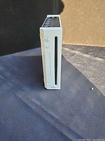 Front view of Nintendo Wii console standing vertically