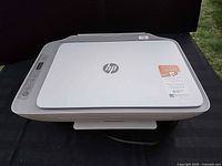 Top view of HP printer with closed lid and control panel