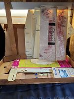 Stack of clear and opaque Bodyfit rulers, paper patterns visible