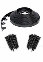 Rolled edging coil with two bundles of anchoring spikes