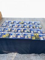 Top view of all ~30 sealed Starting Lineup 1997 figures laid out on table