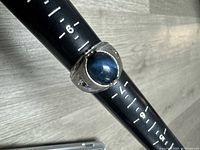 Ring on mandrel showing stone and size 8 marking