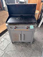 Front view of Blackstone Pro Series griddle grill with hood open