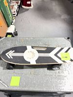 Full top view of electric skateboard on table