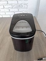 Front and top view of Frigidaire black countertop ice maker