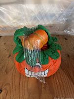 fabric pumpkin basket with additional pumpkin inside