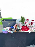 lot overview with tote, stockings, ornaments, tree, snowmen