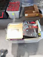 Overview of clear bin filled with vinyl records