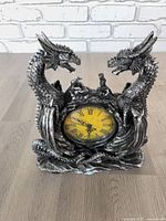 Front view showing entire dragon clock and dial