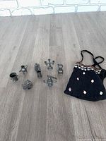 Group shot of all metal miniatures and pouch