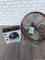 Lakewood floor fan beside sealed Air Monster box