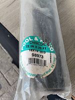 close-up of product label showing size, mesh, model number and barcode