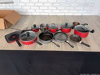 Entire cookware set arranged on table showing all pieces
