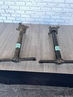 Both metal table stands side by side on floor