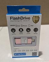 Front of sealed box showing flash drive, capacity options and compatibility icons