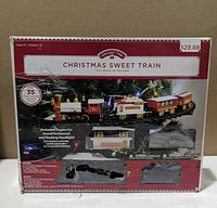 Front of boxed Holiday Time Christmas Sweet Train set showing product image and features