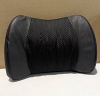 Front view of black Lofty Aim lumbar cushion