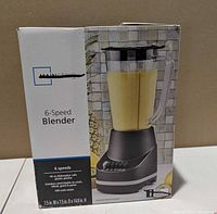 Front view of boxed Mainstays 6-Speed Blender showing product image and key features