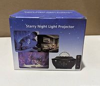 Box front showing Starry Night Light Projector images and remote