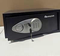 Front view of SentrySafe showing keypad, handle and inserted key
