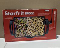 Front of retail box showing product name and image of griddle with food