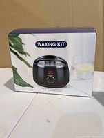 Front view of boxed waxing kit showing product image and features