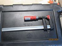 Bessey parallel bar clamp on storage tote