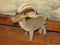 Side view of Steiff ibex plush showing body color, horns, stance