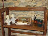 Shelf view showing all five Avon collectible bottles with two original boxes
