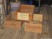 Three stacked cedar wine crates showing branding and size