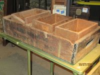 Crate with three small boxes nested inside, showing overall lot